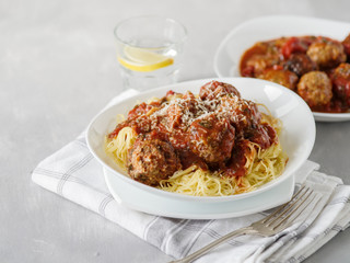 Delicious homemade meat balls in tomato sauce with spaghetti.