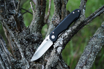 folding travel knife in stainless steel with black handle made o