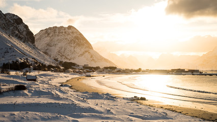 Sunset in a snow covered beach in Lofoten Island, Norway