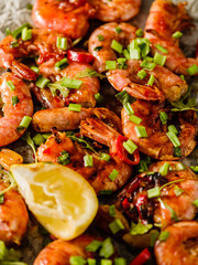 Large grilled BBQ shrimp with sweet chili sauce, green onion and lemon.