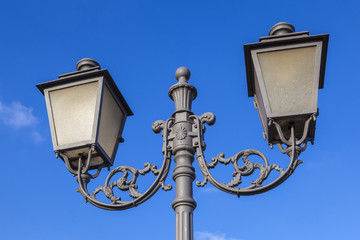 Fototapeta na wymiar old vintage lantern under blue sky
