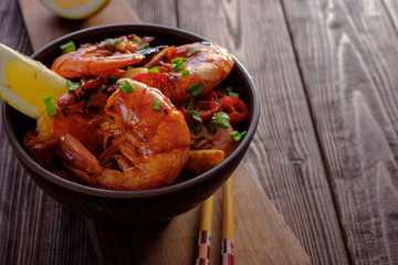 Large grilled BBQ shrimp with sweet chili sauce, green onion and lemon.