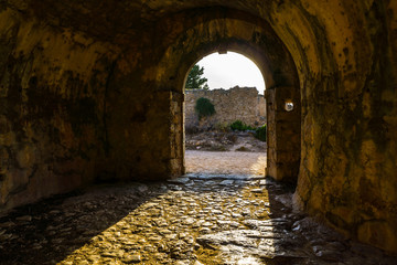 Fototapeta premium Castle gate of castle in Assos village of Cephalonia island in Greece. Is one of the largest castles in Greece and its construction, in late-16th century, was an ambitious project by the Venetians