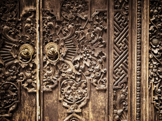 Carved Wooden Door with Floral and Geometric Designs. Ubud, Bali, Indonesia. December 2015