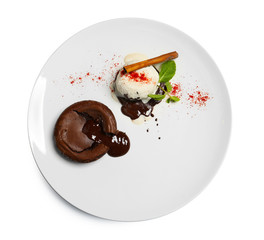 Plate with delicious fondant cake and vanilla ice-cream on white background