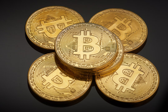 Golden bitcoin coin. Crypto currency golden coin bitcoin symbol on black background.