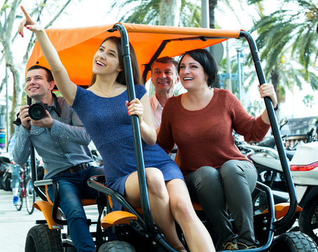 Family Of Four Sitting In Grand Tour Electric