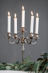 Silver chandelier with candles on the table