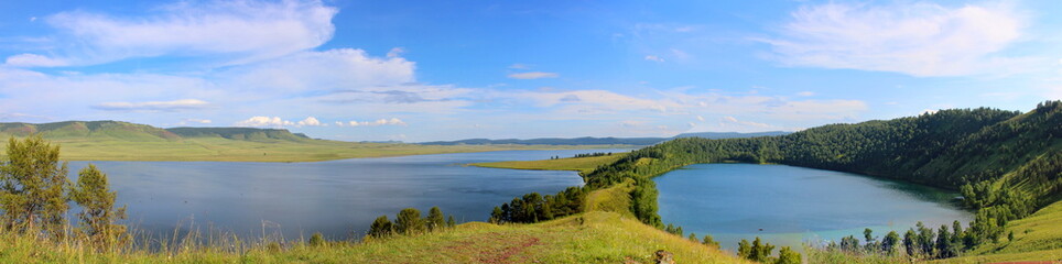 Fototapeta na wymiar awesome wide angle panoramic view to summer landscape in republic of Khakassia, Siberia with two deep lake in mountain countryside. Lakes of tectonic origin