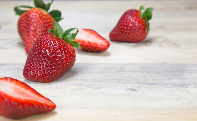 Fresh strawberry on wooden background.