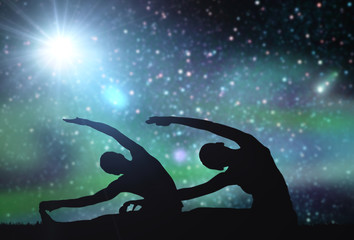 Obraz na płótnie Canvas couple making yoga exercises over space background