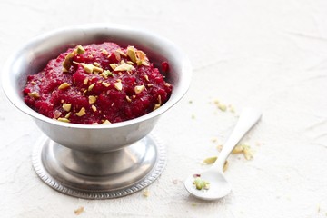 Homemade Beetroot Halwa with Pistachio garnish, selective focus