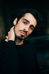 Sad and depressed Mediterranean looking young man