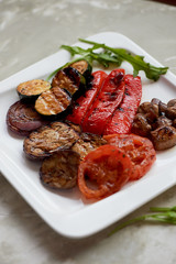 Delicious shiny vegetables, toasted on the grill. Eggplant, pepper zucchini