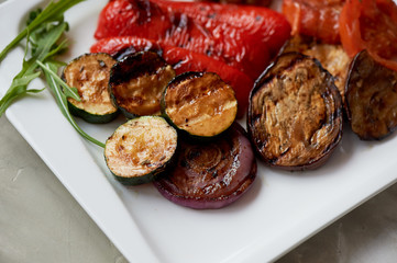 Delicious shiny vegetables, toasted on the grill. Eggplant, pepper zucchini