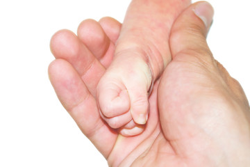 hand of a newborn baby in the hand of a young father on an isolated white background