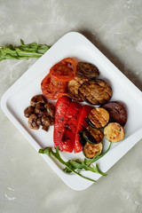 Delicious shiny vegetables, toasted on the grill. Eggplant, pepper zucchini