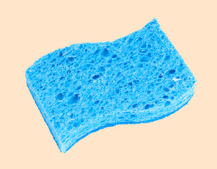 Blue sponge on pastel background