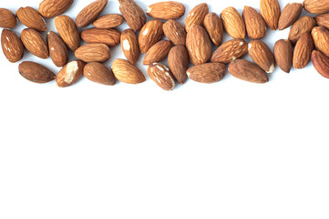 A lot of almond grains on a white background.