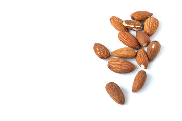 A lot of almond grains on a white background.