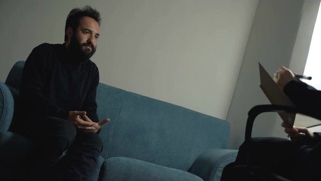 Anxious Man At Therapy Session, talking with Psychologist