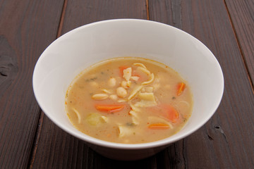 Bean soup with noodles on a background