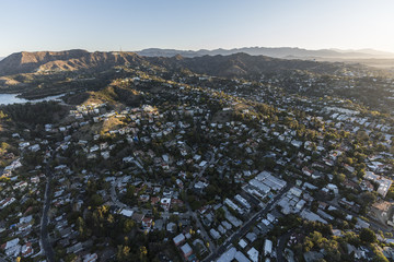 Aerial morning view of hillside homes in the Hollywood Hills neighborhood near Griffith Park in Los Angeles California.