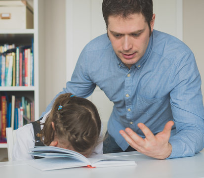 Dad Is Angry Because His Daughter Don't Want To Do Her Homework.