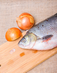 Raw fish  ide on a chopping Board