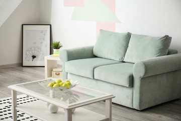 Stylish living room interior with table and comfortable sofa