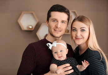 Young parents with baby at home