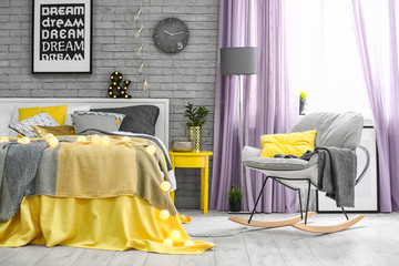Comfortable soft bed with pillows in modern room