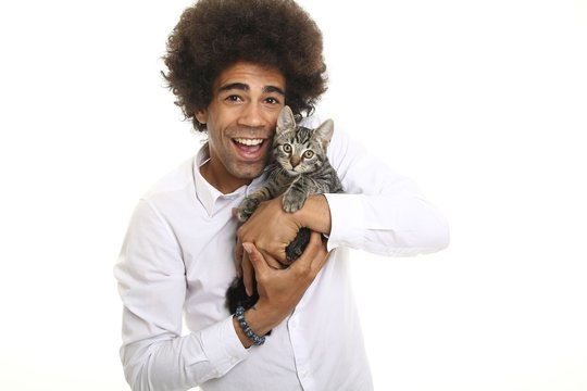 Afro man with a cat