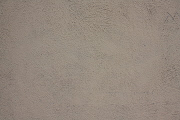 Pale plastered wall texture background in black and white with vignette