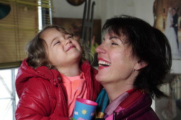 mom and daughter smiling