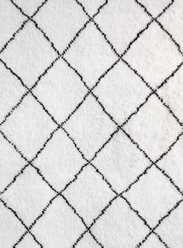 Detail of white rug with black lines
