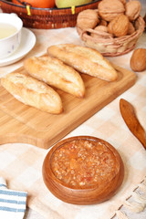 Tomato beef sauce with bread on wooden table