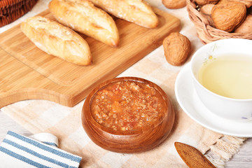 Tomato beef sauce with bread on wooden table