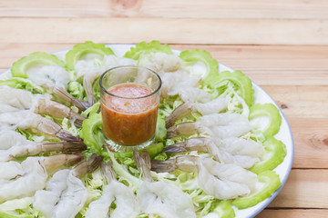Raw peeled shrimp seafood and sauce.