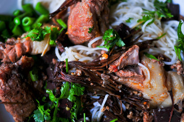 Bowl of spicy noodle soup, Traditional northern of thailand style cuisine (Khanom Jin Nam Ngiao)