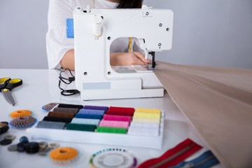 Fashion Designer Stitching Cloth On Sewing Machine