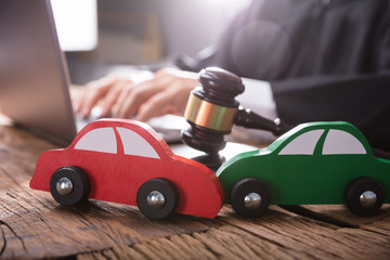 Close-up Of Two Green And Red Wooden Cars