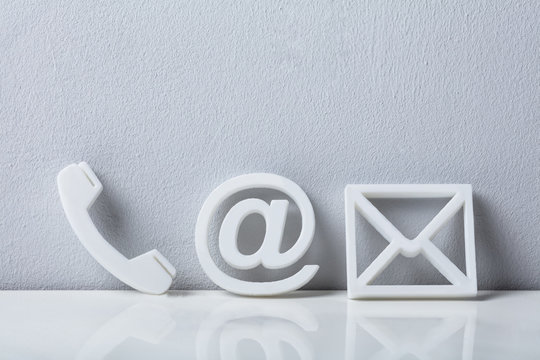 Close-up Of A Phone, Email And Post Icons