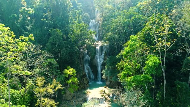 4k Video shot aerial view by drone. Kuang Si Waterfall Famous Landmark Nature Travel Place Of Luang Prabang City, Laos. Bird eye view landscape.