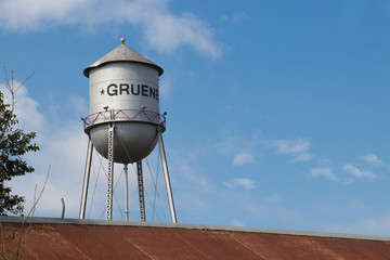 an old rusty roof and the Gruene Texas water tower