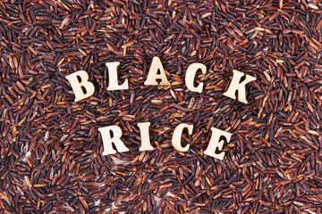Heap of black rice as background, healthy gluten free food concept