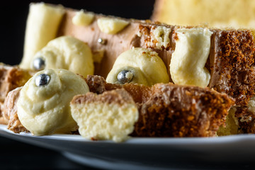 delicious home made biscuit cake on a black background