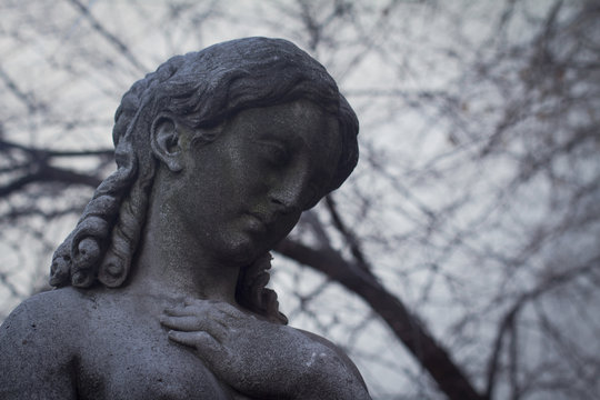 closeup of woman stone statue