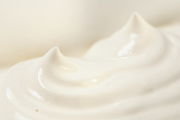 Whipped cream peaks - abstract macro photo with shallow depth of field.