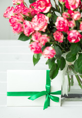 rose in glass vase with gift card